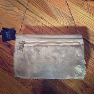 Beige leather clutch with faux fur